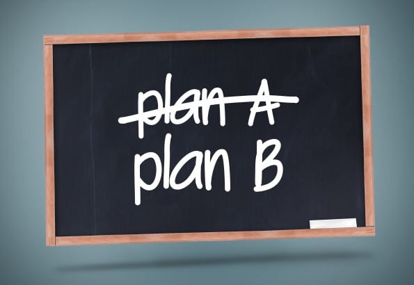 Plan A and Plan B written on a blackboard against grey background