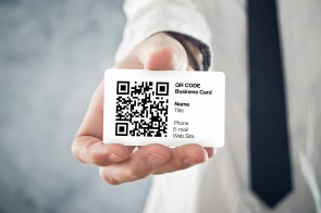 Businessman holding QR code business card