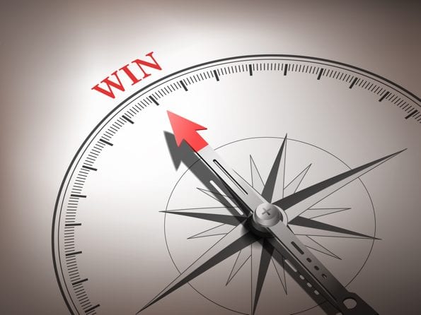 abstract compass needle pointing the word win © kchungtw - Fotolia