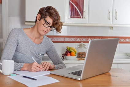 woman working or blogging in home office.
