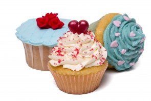 Close up view of original and creative cupcake designs isolated on a white background.